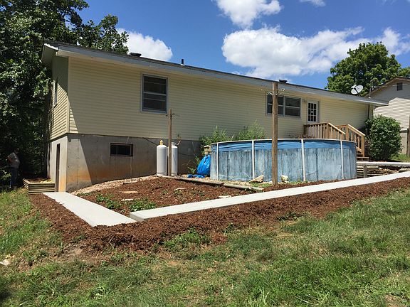 Pool and strawberry patch. 