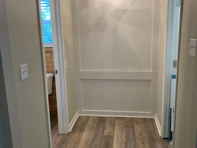 Primary bedroom open area has multiple uses. Large closed to right and bathroom to left