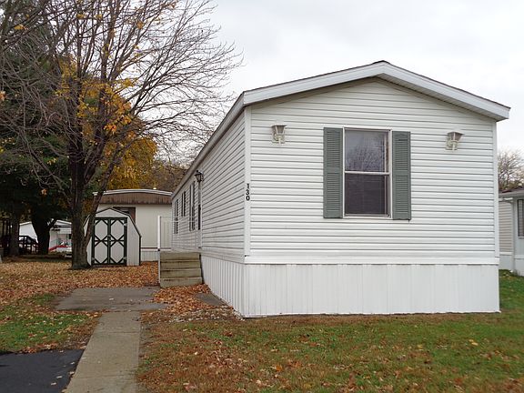 Front of home with mini barn