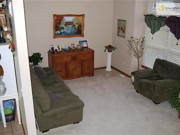 Seating room right inside front door, kitchen and dinning room on the other side of wall