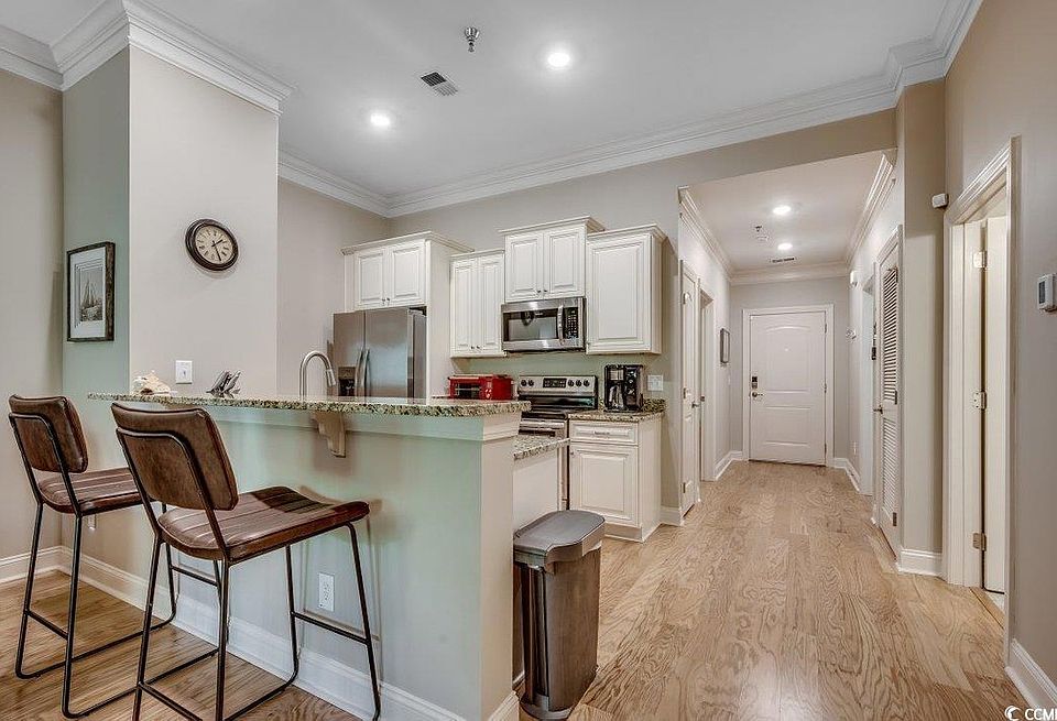 High ceilings, granite counter tops, soft close cabinetry, stainless steel appliances.