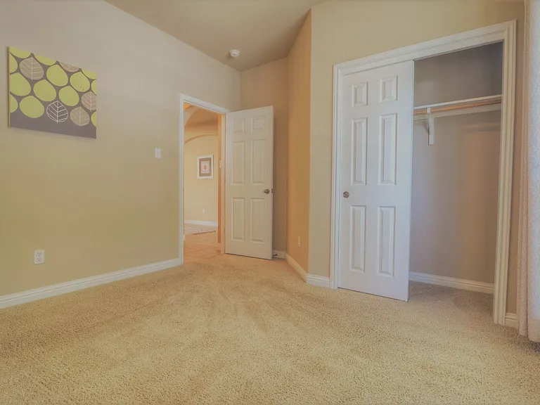 Downstairs guest bedroom looking into front hallway