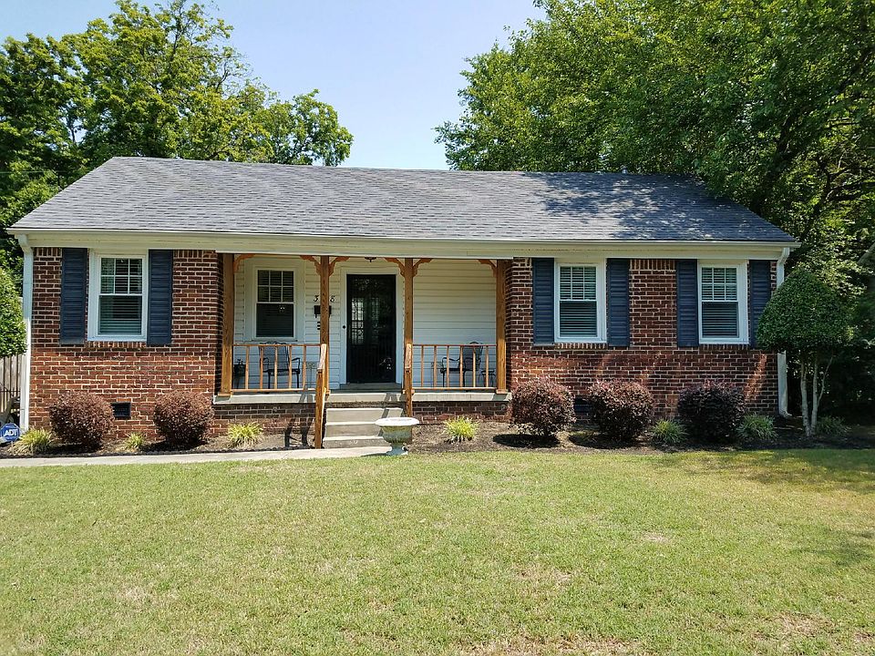 Very maintained and well kept yard. Front porch looks across the street to the Greenline Walking trails!