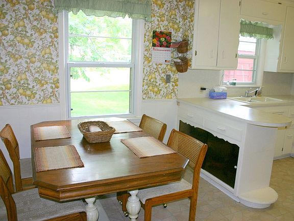 The breakfast nook has a great view of the park-like backyard.