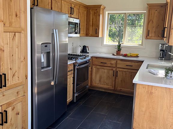 Fully stocked kitchen with full sized appliances.