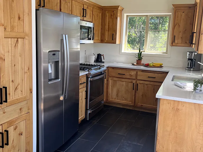 Fully stocked kitchen with full sized appliances.