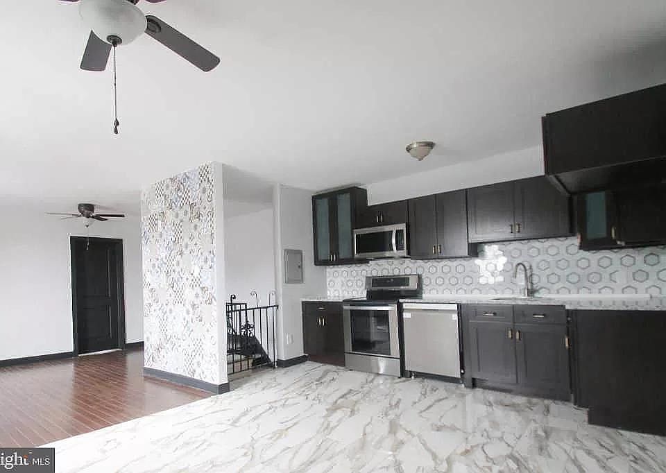 View from the corner showing living area and kitchen.