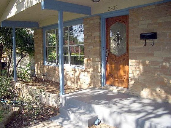  The inviting front porch and entry. The porch would lend itself well to havin