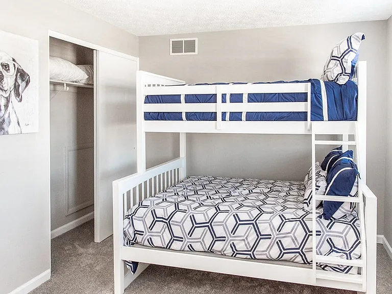 Another view of large second bedroom with wall-to-wall carpeting and closet
