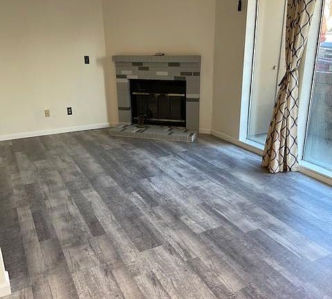 Large Living area with wood burning fireplace for cozy evenings.