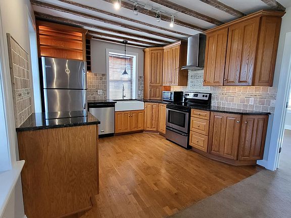 Kitchen with wood floor.