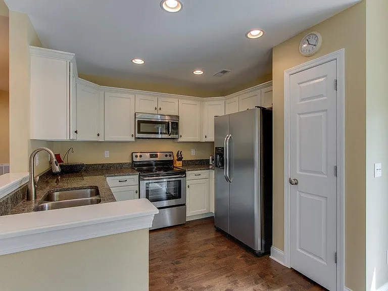 stainless steel appliances with spacious counter and cabinets