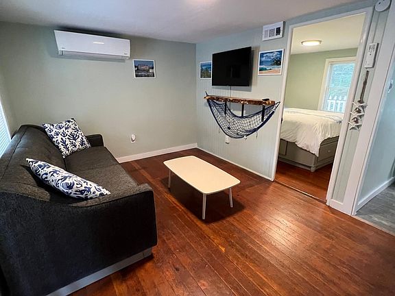 Living room with Queen pullout couch, one master bedroom