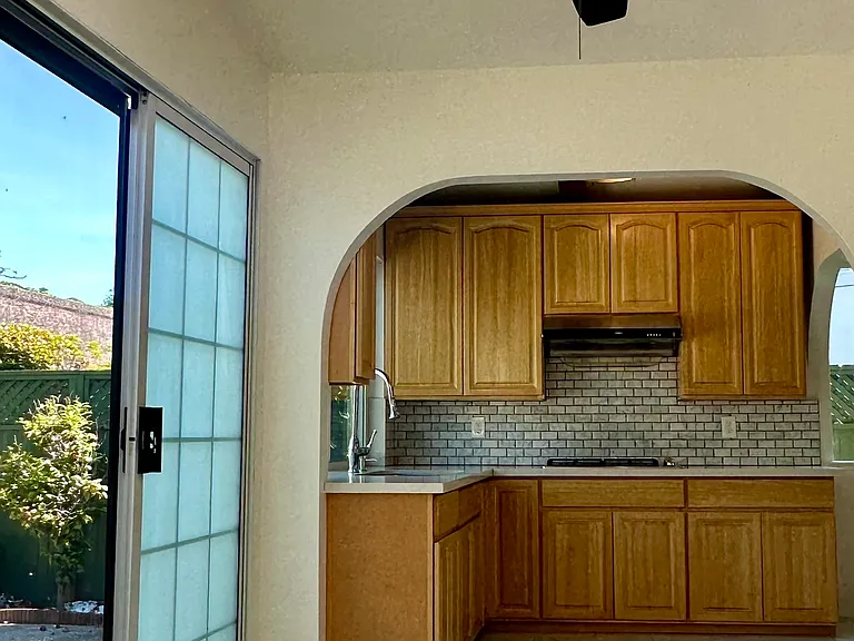 Dining area off the kitchen with skylight and access to the backyard