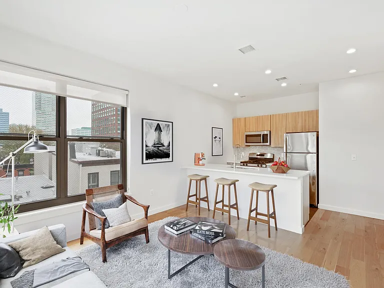 Bright, Open Living Spaces with Large Windows to Take Advantage of City Views