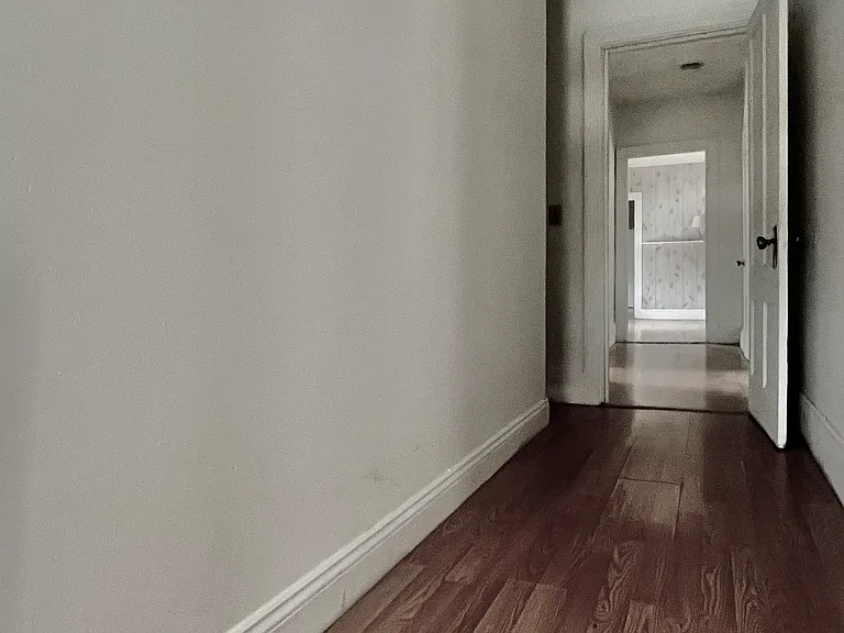 Hallway to bedroom #2 and to office space