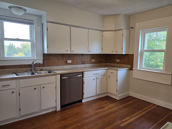 Plenty of cabinets, windows overlooking the back yard and the driveway. Dishwasher