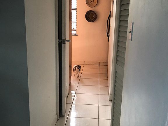 hallway with closet (with stacking w/d hookup)