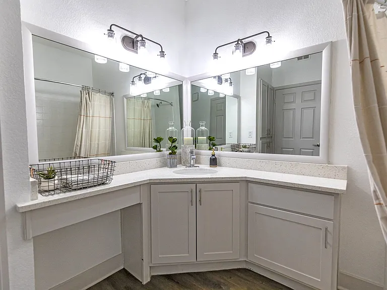 Large vanities and mirrors provide plenty of space for your everyday needs.