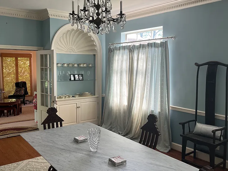 Formal dining room. Custom built-in display cabinets. Plaster walls and ceilings.