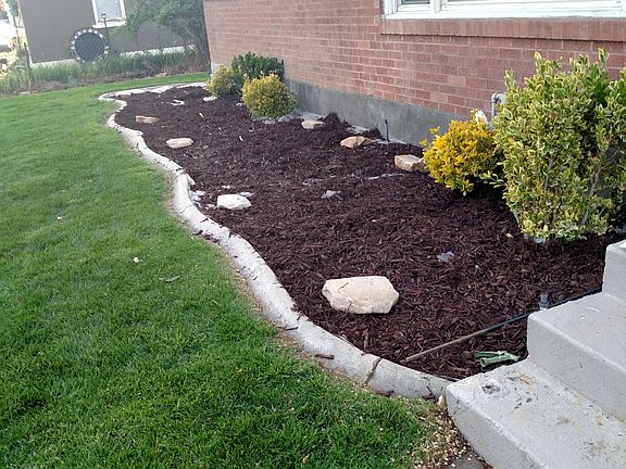 Refinished front flower bed 