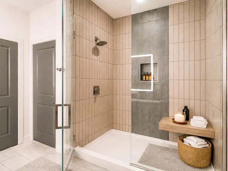 Penthouse bathrooms feature spa-inspired showers, clean-lined tilework, and refined finishes designed for everyday comfort and ease.