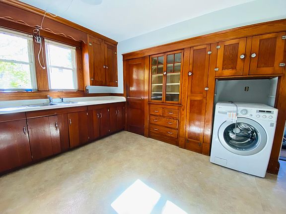 Kitchen with built-ins and washer