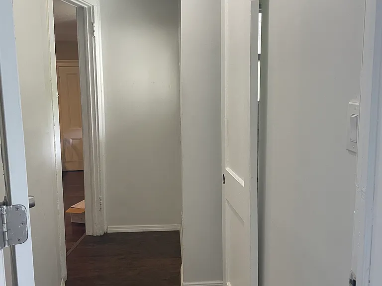 Apartment entrance, bathroom on right