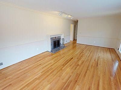 Large and Bright Living Room with Newly Finished Hardwood Floor