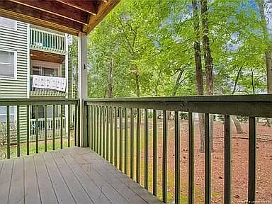 Balcony with serene view of trees.