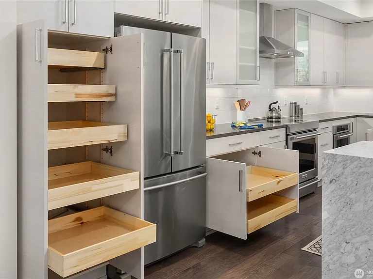 Lots of storage in kitchen, all cabinets feature pull-outs