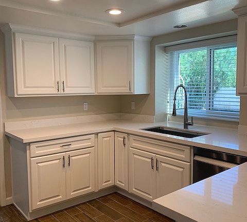 New cabinets, recessed lighting, quartz countertops, new appliances, sink and faucet