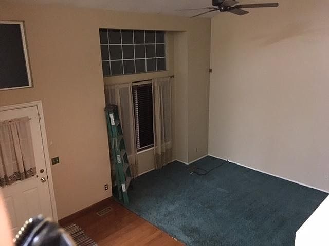 Looking down from bedroom into living room and front door.