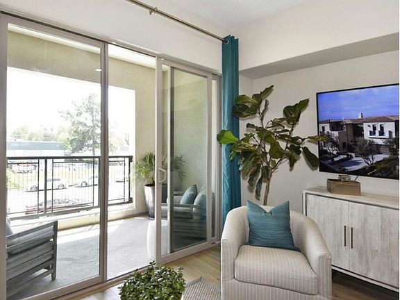 Patio and 8 ft sliding doors with 10 ft ceilings.