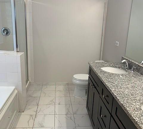 bathroom 1 with separate shower and tub and double bowl sink