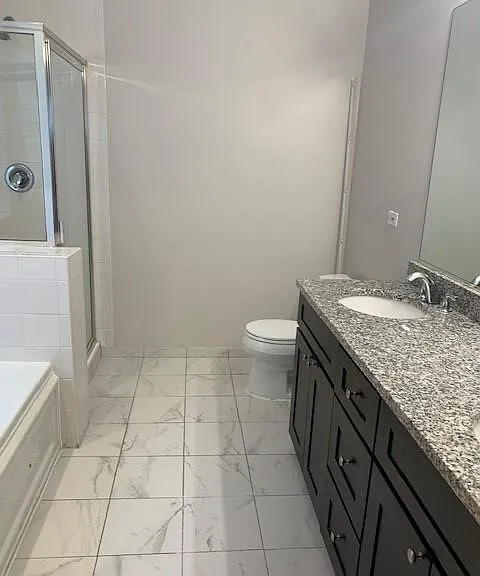 bathroom 1 with separate shower and tub and double bowl sink