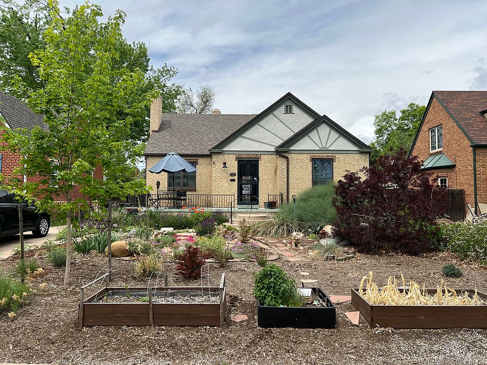 Xeriscaped front yard with 3 raised garden beds for seasonal planting