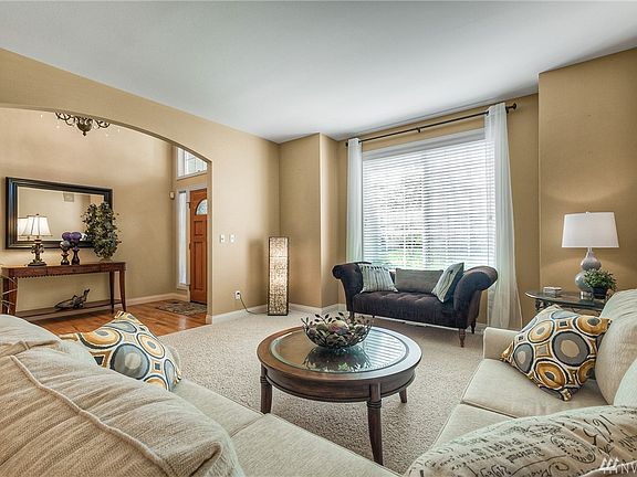 Formal living room, spacious with large window and lots of light.