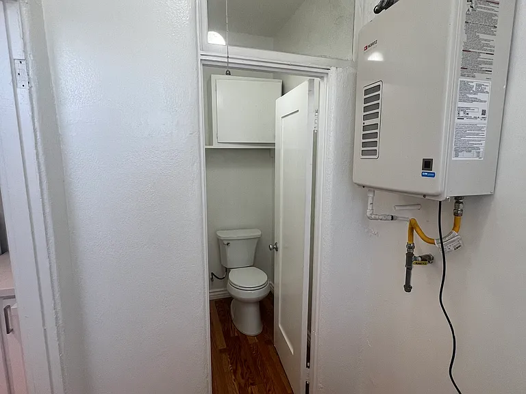 1/4 bathroom downstairs & utility room