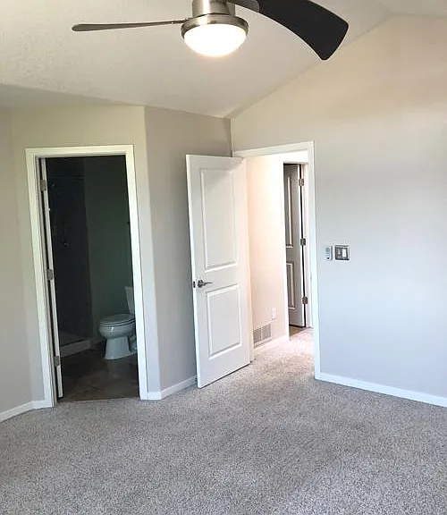 Primary bedroom has attached bathroom and walk-in closet