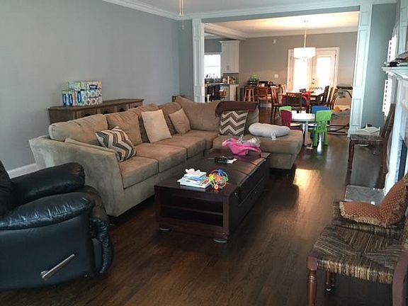 large living room opens into dining area and kitchen