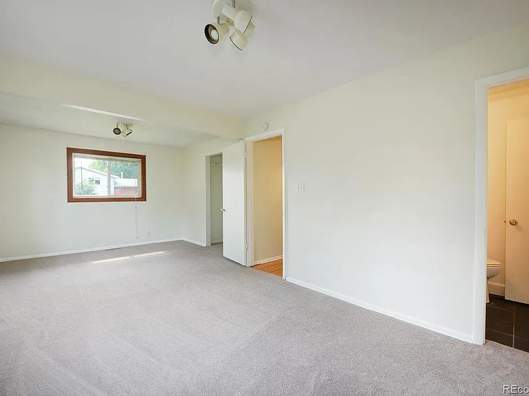 Primary Bedroom w/ Half Bath