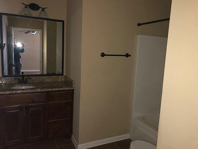 One bathroom with tub/shower combo and the other with shower