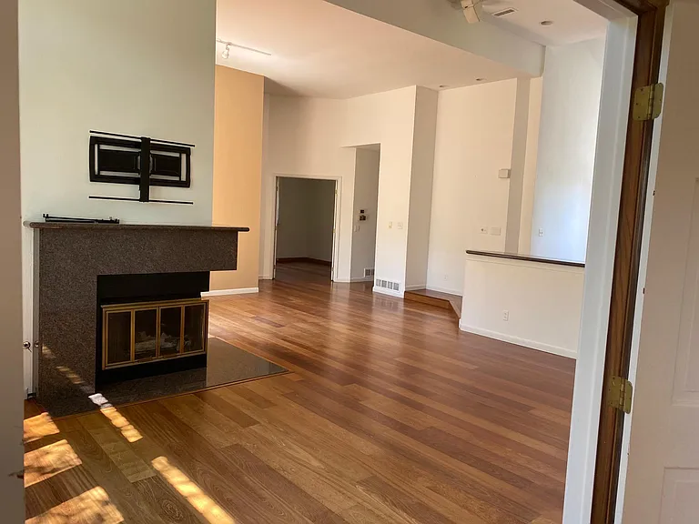 Living room viewed from master en suite bedroom. Gas fireplace