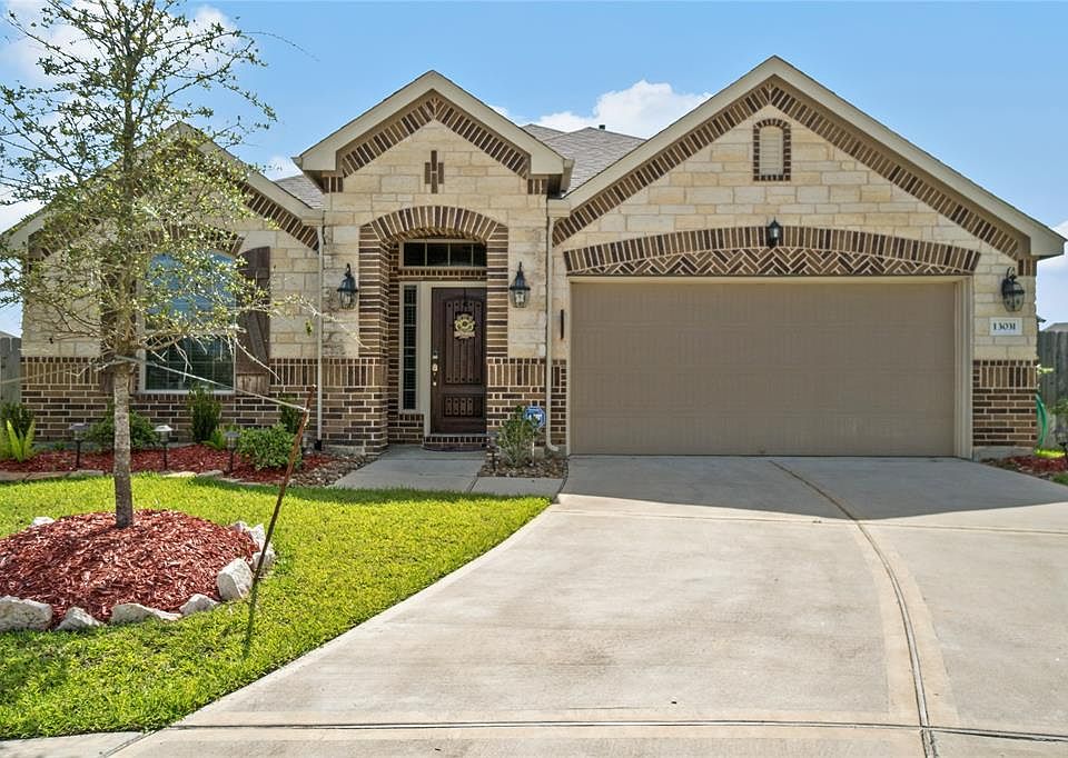 Welcome home to 13031 Lily Crest. The gorgeous stone and brick elevation adds character and curb appeal.