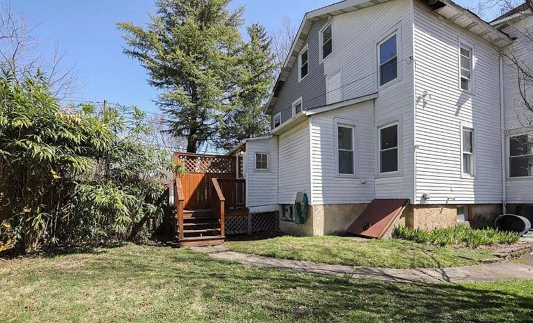 backyard with bilco doors to basement