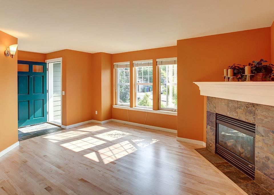 Living room with gas fireplace, hardwood floors throughout the main level