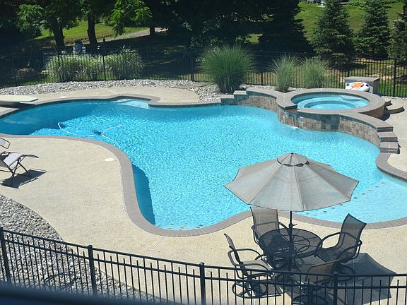 Custom built in ground heated pool with jacuzzi