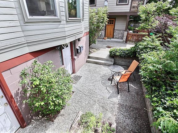 Patio area in front of apartment unit doors (both doors belong to this apartment unit)