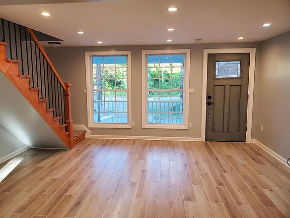 Inviting living area with bright windows and recessed lighting.